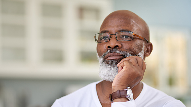 A man puts his hand to his chin in thought. This page explains the steps Social Security takes to determine your eligibility for SSD benefits.